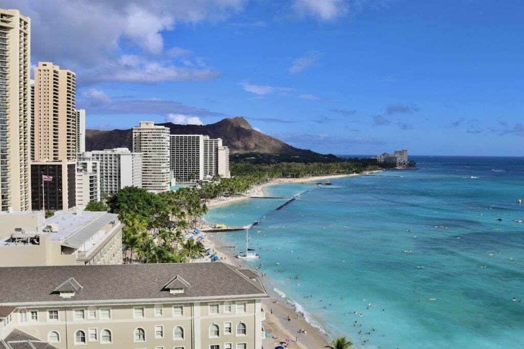 a view of a beach with buildings in the background